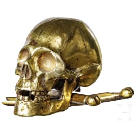 A gilt bronze skull, circa 1600