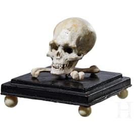 A wooden memento-mori skull, circa 1800