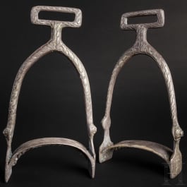A pair of silver Viking stirrups with interlaced band and decorated with stylised animals, 9th century