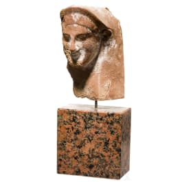 A head of a veiled woman, archaic, late 6th century B.C.