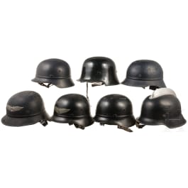 Seven steel helmets for fire fighters or air raid wardens