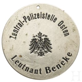 A warrant disc of the Central Police Department Osten
