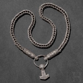 A silver necklace with animal head ends and Thor's hammer in Mammen style, 10th century