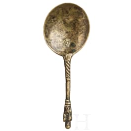 A Dutch late Gothic brass spoon with figural knob, circa 1500
