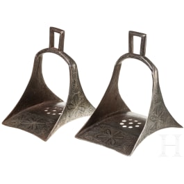 A pair of Persian silver damascened stirrups, 19th century