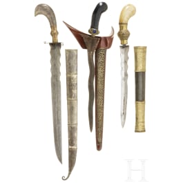 An Indonesian kris and two parangs, circa 1900