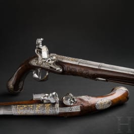 Ein Paar prunkvolle, eisengeschnittene Steinschlosspistolen, deutsch, um 1780
