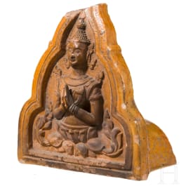 An orange-glazed front of a Thai roof tile (end of a monk tile) decorated with a temple guardian, circa 1900