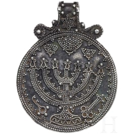 An Eastern European Jewish silver pendant with depiction of a menorah, 18th century
