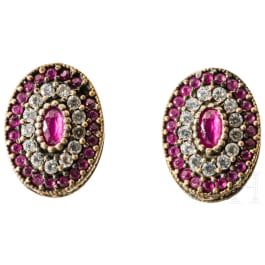 A pair of earrings with pink spinel