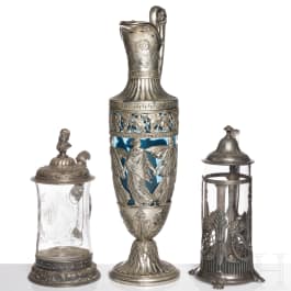Three metal-mounted glass jugs, WMF, Geislingen, circa 1900