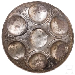 An eastern Greek silver phial with seven discs and lotus decoration, 5th century B.C.