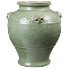 A Chinese molded Longquan celadon jar, probably Yuan Dynasty