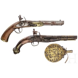 Two Moroccan flintlock pistols and a powder flask, 19th./20th century
