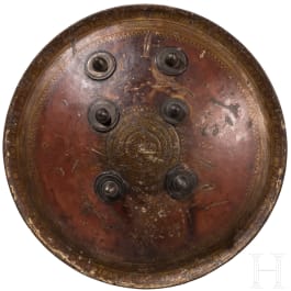 A painted Indian leather shield, circa 1800