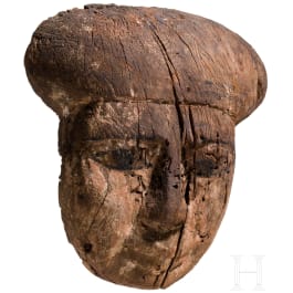A wooden mummy mask with traces of paint, Late Period, mid-3rd of the 1st millennium B.C.