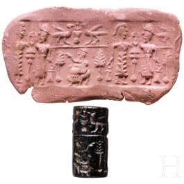 Ancient Babylonian cylinder seal made of brown jasper depicting a cult scene, approx. 1900&ndash;1700 B.C.