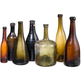 Seven German glass bottles, 18th (wine bottle)/19th century