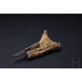 A fine South German carved staghorn powderflask with etched mountings, dated 1597