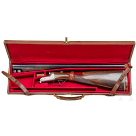 A cased side-by-side shotgun by Churchill, London