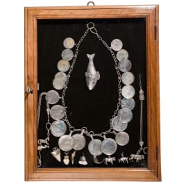 A group of German and Polish silver trinkets including a shooting champion's necklace, 19th century
