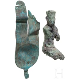 Bronze statuette of the seated god Amun and bronze insert of a crown with sun disc and double feather. Late period, middle third of the 1st millennium B.C.