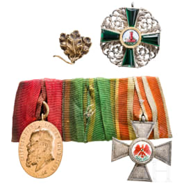 A three-piece Baden medal bar