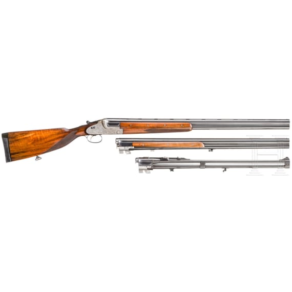 A Merkel 203 over-and-under shotgun with interchangeable over-and-under shotgun barrel and rifle barrel, with Schmidt & Bender scope