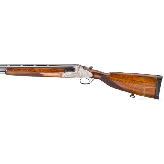 A Merkel 203 over-and-under shotgun with interchangeable over-and-under shotgun barrel and rifle barrel, with Schmidt & Bender scope