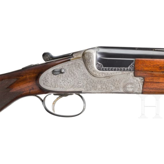 A Merkel 203 over-and-under shotgun with interchangeable over-and-under shotgun barrel and rifle barrel, with Schmidt & Bender scope