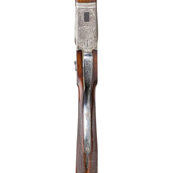 A Merkel 203 over-and-under shotgun with interchangeable over-and-under shotgun barrel and rifle barrel, with Schmidt & Bender scope