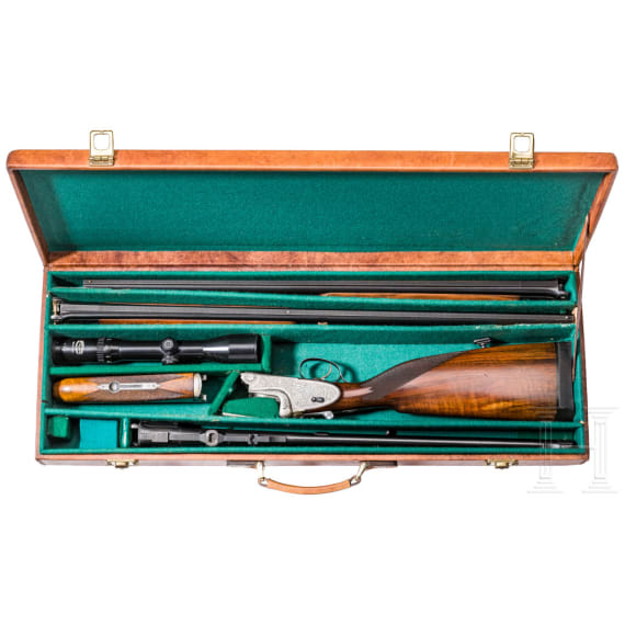 A Merkel 203 over-and-under shotgun with interchangeable over-and-under shotgun barrel and rifle barrel, with Schmidt & Bender scope