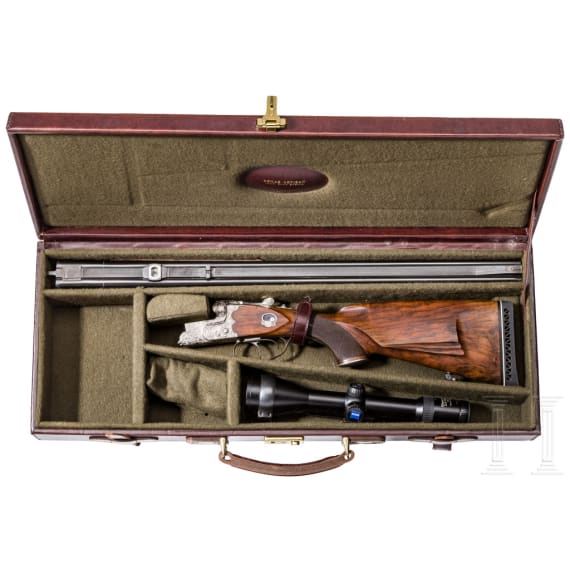 A cased double-rifle drilling, Suhl, with Zeiss scope