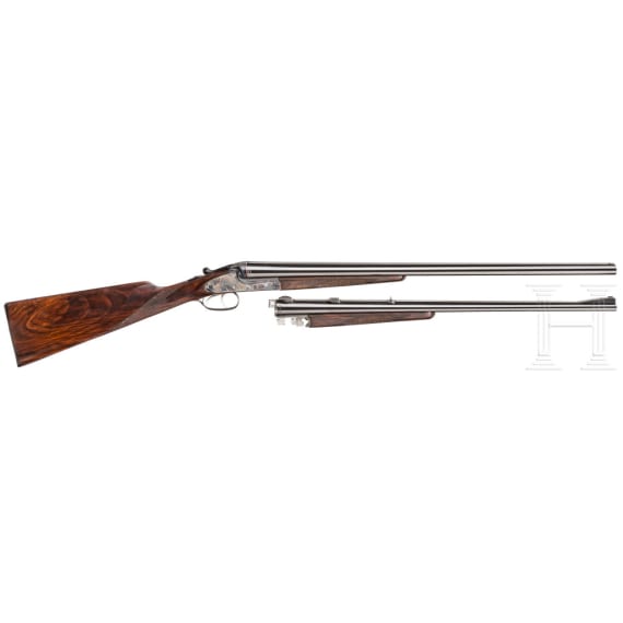 A Merkel side-by-side double rifle with Meopta scope and interchangeable side-by-side shotgun barrel