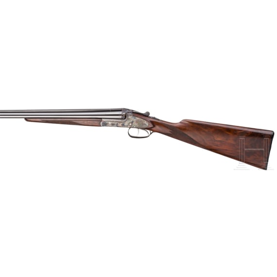 A Merkel side-by-side double rifle with Meopta scope and interchangeable side-by-side shotgun barrel