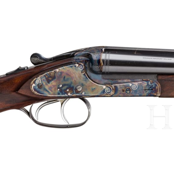 A Merkel side-by-side double rifle with Meopta scope and interchangeable side-by-side shotgun barrel
