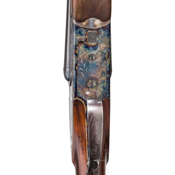 A Merkel side-by-side double rifle with Meopta scope and interchangeable side-by-side shotgun barrel
