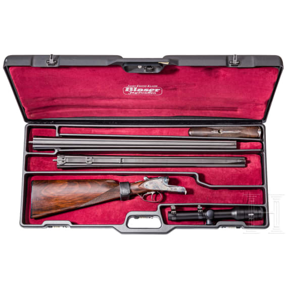 A Merkel side-by-side double rifle with Meopta scope and interchangeable side-by-side shotgun barrel