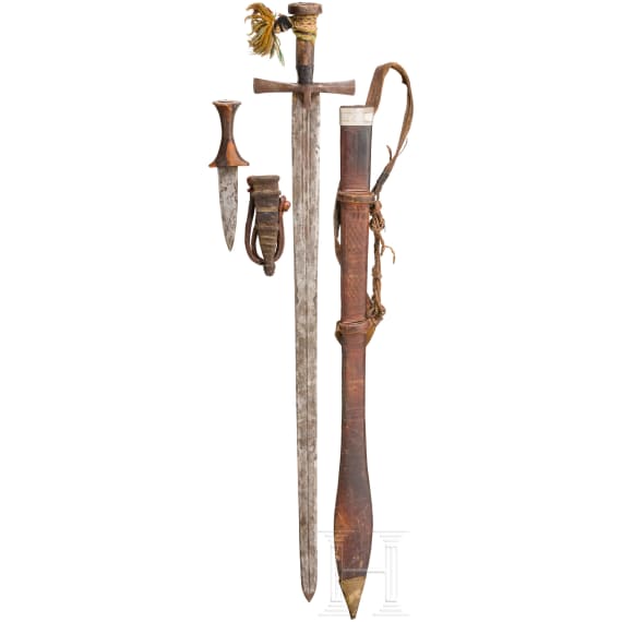 A kaskara and an arm dagger, North Africa, circa 1900