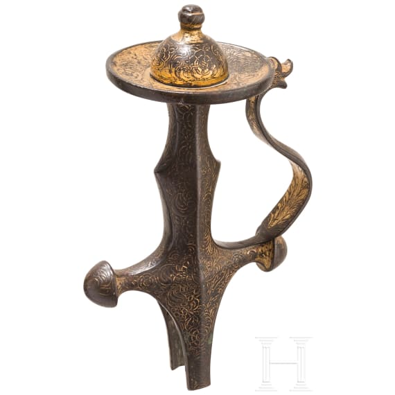 An Indian gilded tulwar grip, 19th century