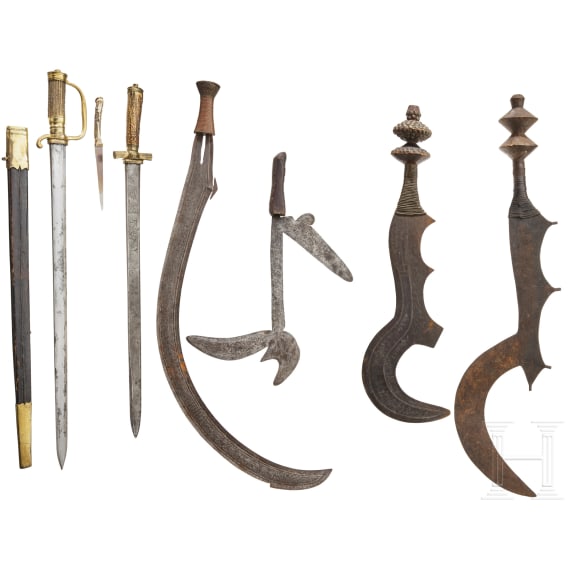 A sabre weapon of the Benge, a throwing knife of the Zande and two Ngombe swords
