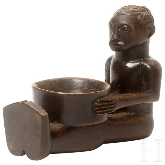 A wooden sculpture of a sitting boy holding a bowl, Luba, Congo