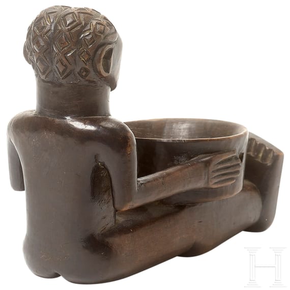 A wooden sculpture of a sitting boy holding a bowl, Luba, Congo