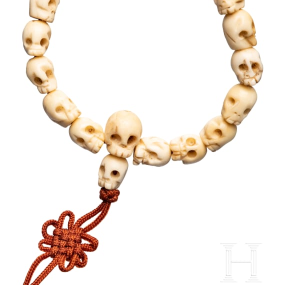 A Tibetan skull necklace, circa 1900