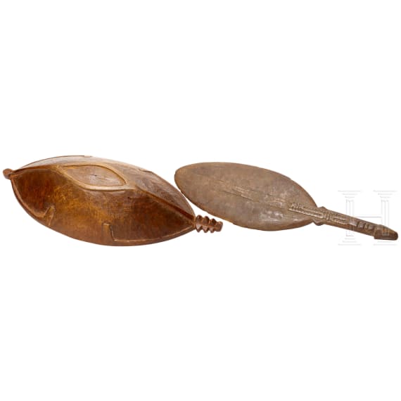 A wooden bowl and a dancepaddle, Papua New Guinae