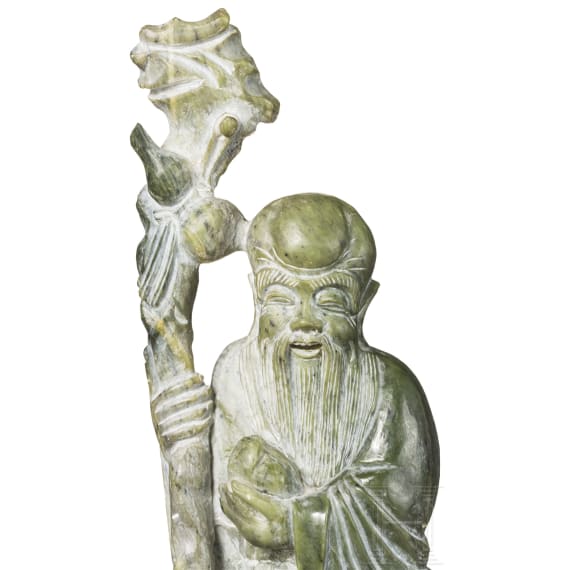 A figure of the god Shoulao in light green nephrite, 20th century
