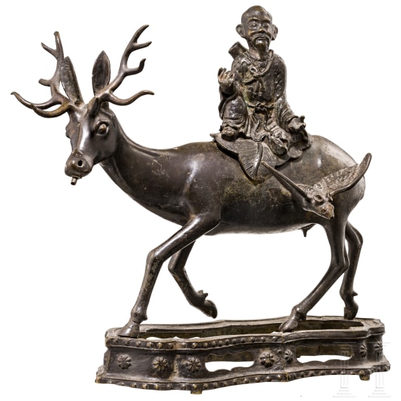 A bronze sculpture of a deer with a wise man, China, 18th century