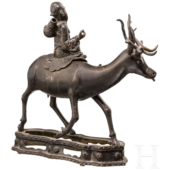 A bronze sculpture of a deer with a wise man, China, 18th century