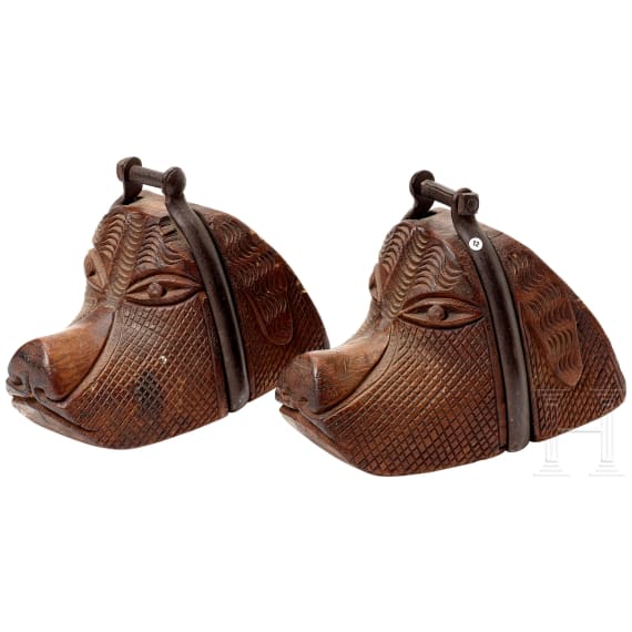 A pair of South American stirrups in the shape of a dog's head, 19th century