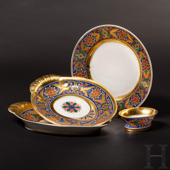A Russian plate, two oval bowls and a spice container from the Gothic service, Imperial Porcelain Manufactory St. Petersburg, reign of Tsar Nicholas I, ca. 1833/40